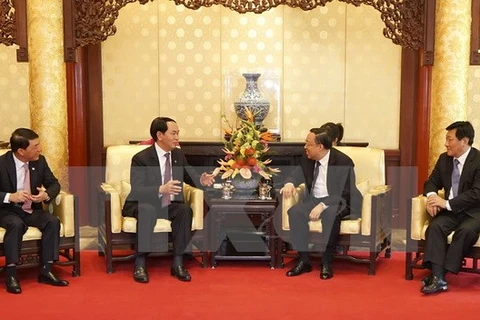 Le ministre de la Sécurité publique Tran Dai Quang et le ministre chinois de la Sûreté de l'Etat Geng Huichang. (Source: VNA)